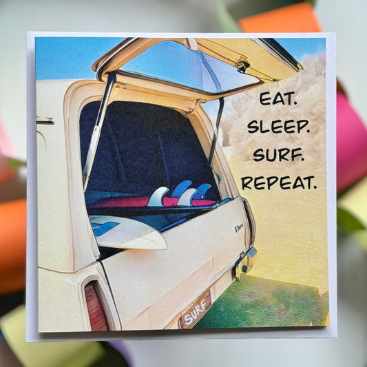 A panelvan with surfboards with Eat.Sleep.Surf.Repeat written on it Greeting Card with envelope