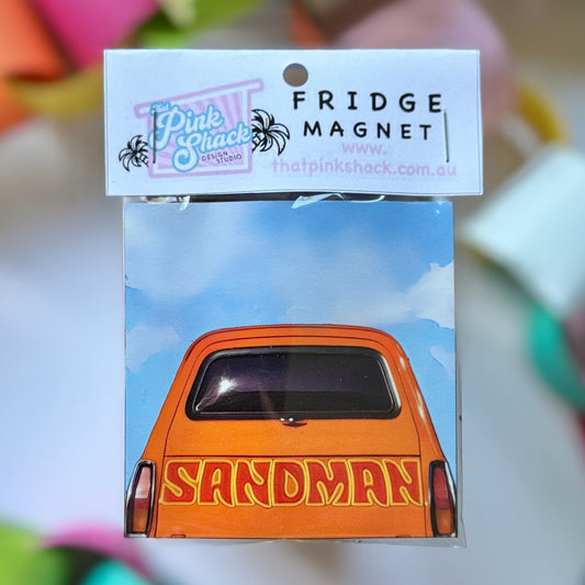 A  fridge magnet with a classic orange Holden sandman panelvan in packaging