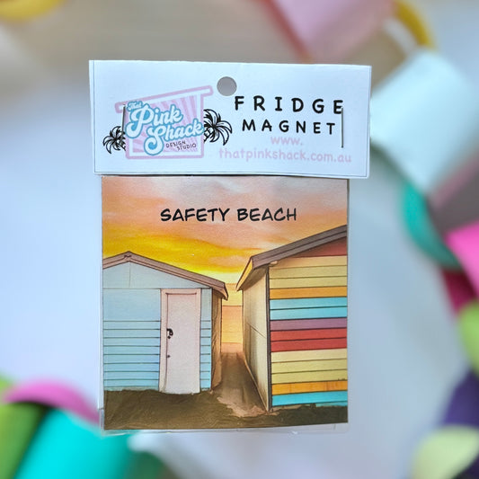 A fridge magnet of two colourful boasheds at sunset at Safety beach on the Mornington peninsula in packaging