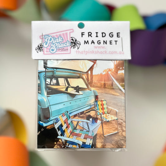 Fridge magnet of a classic eh Holden wagon with a surfboard with retro camp chairs and esky in packaging